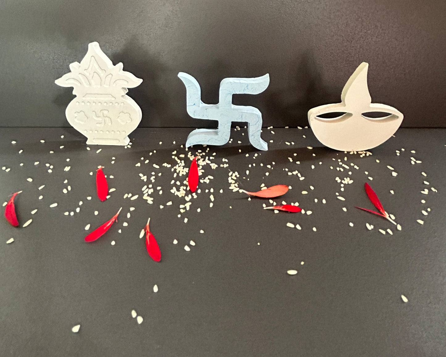 Decorative items including a Kalash, swastika symbol,