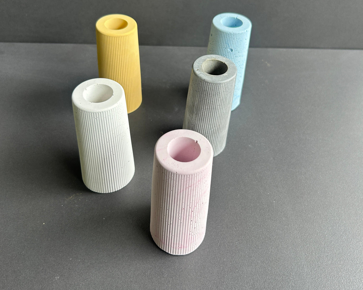 Set of five colorful cylindrical vases