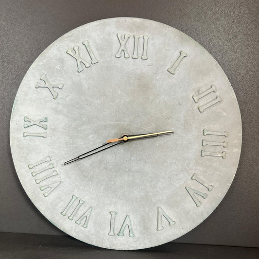 Concrete wall clock with Roman numeral