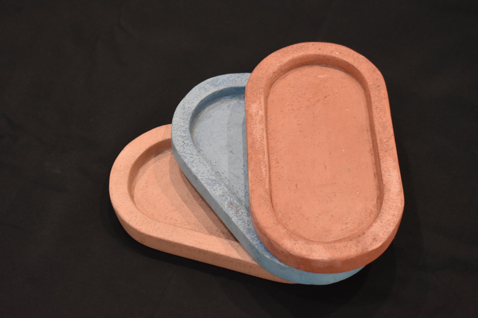 Concrete Three oval trays in different colors 