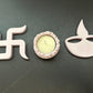 Decorative items including a swastika symbol, a small candle holder, and a Diwali lamp 