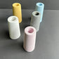 Set of five colorful cylindrical vases