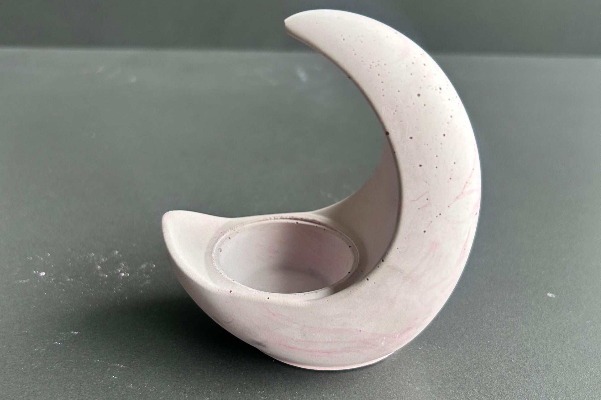 Ceramic crescent moon-shaped candle holder