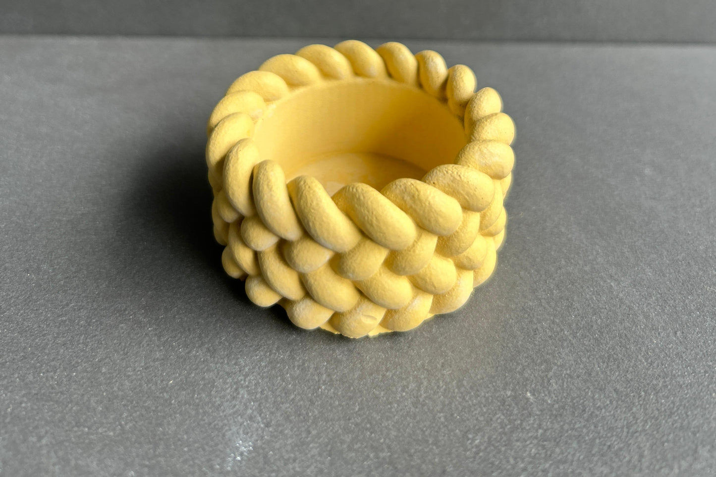 Braided yellow candle holder